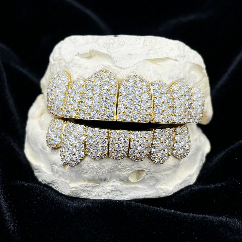 Diamond pavé gold grillz on black velvet